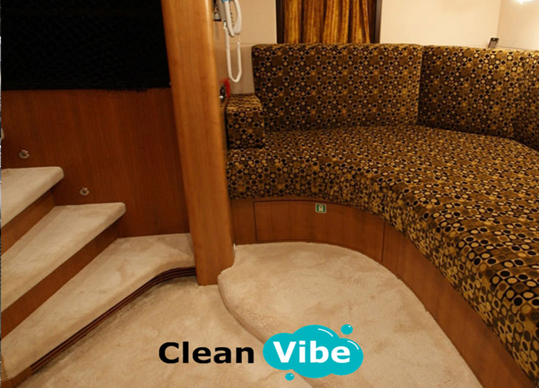 Curved sofa and stairs in yacht interior