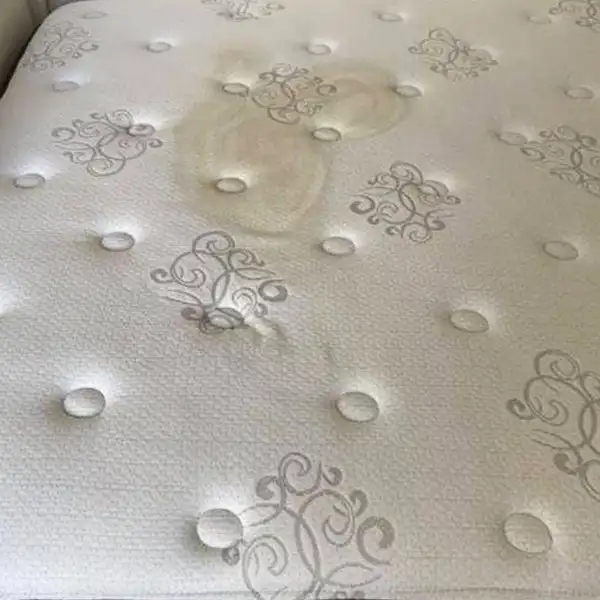 Eliminating drink spill stains from mattress fabric