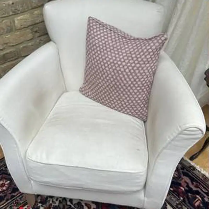 White armchair professionally cleaned