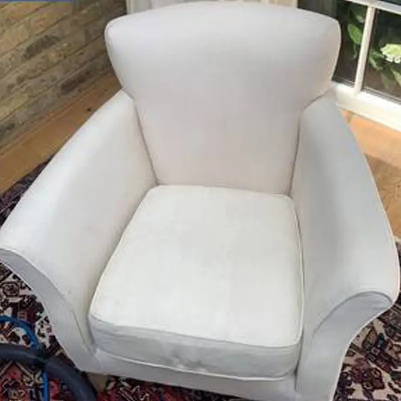 Bright white fabric chair after upholstery cleaning