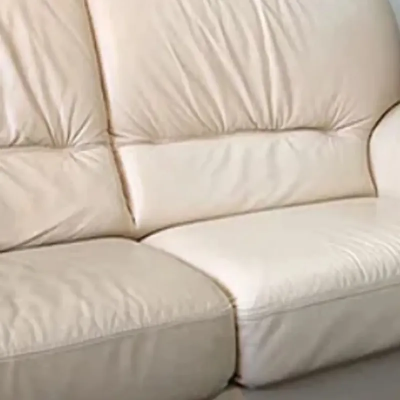 Stained leather sofa cushions before cleaning