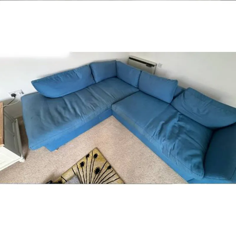 Blue sectional before removing dust buildup
