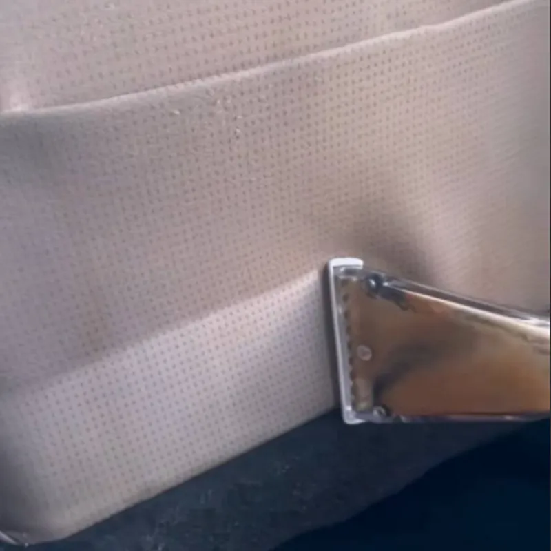 Soiled tan sofa during cleaning process